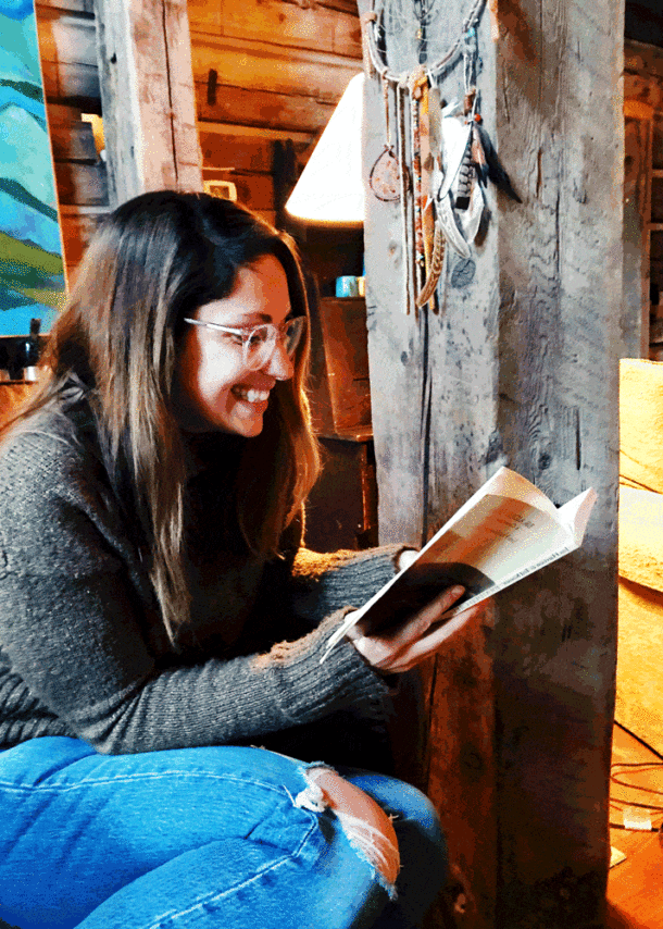 Young writer reading her book at the Haven Writing Retreat