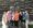 Group of women in front of log building smiling after completing the Haven Writing Program